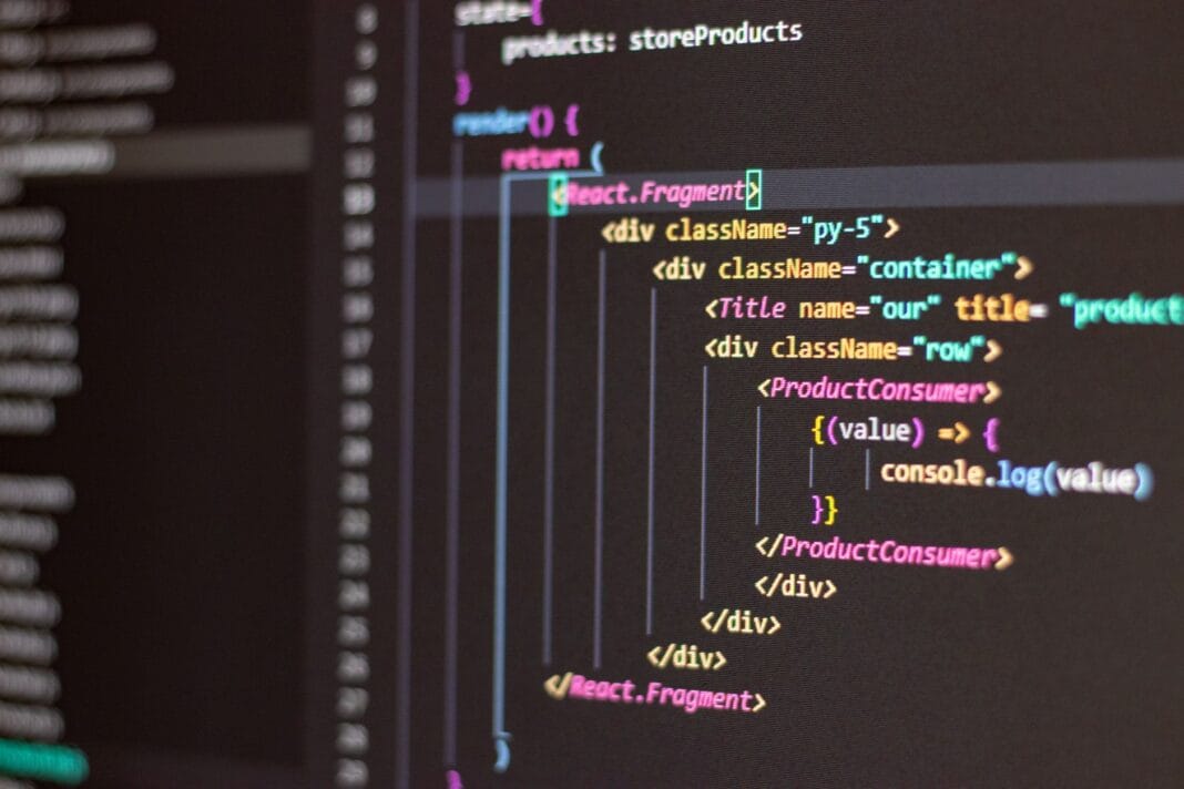 Zbliżenie ekranu z kodem HTML i JavaScript w edytorze Visual Studio Code Zbliżenie ekranu z kodem HTML i JavaScript w edytorze Visual Studio Code